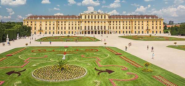 View of the large parterre with colorful flowerbeds in the foreground